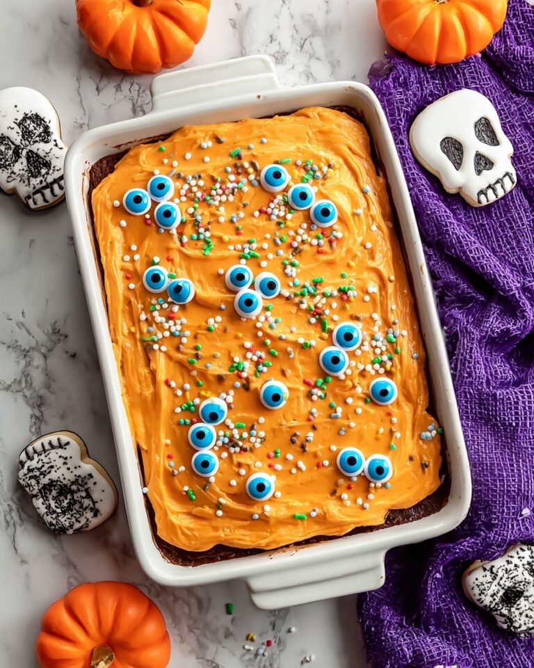 Halloween Cinnamon Rolls with Orange Cream Cheese Frosting and Festive Decorations Recipe